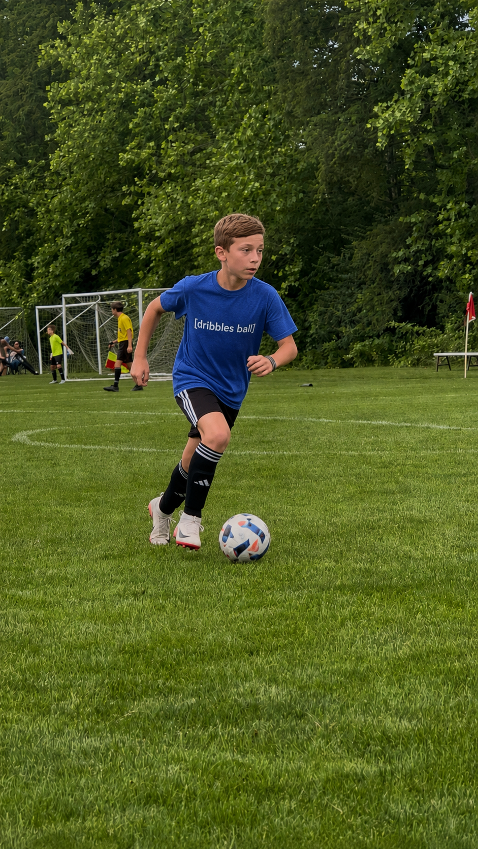 [dribbles ball] — Youth Tee
